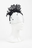 Black leather flower and laser cut headband with veil by Amanda Dudley Millinery